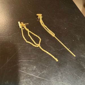 T bat drop earrings.